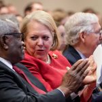 Associate Supreme Court Justice Clarence Thomas sits with his wife, conservative activist Virginia Thomas, at an October 2021 event. (Drew Angerer/Getty Images)