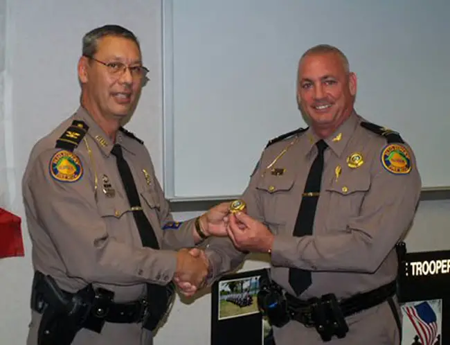 The Florida Highway Patrol's Michael Thomas, right, when FHP Director David Brierton promoted him in 2011. (FHP)
