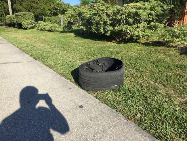 One of the SUV's tire shards off a C-Section street. (c D. Evanac for FlaglerLive)