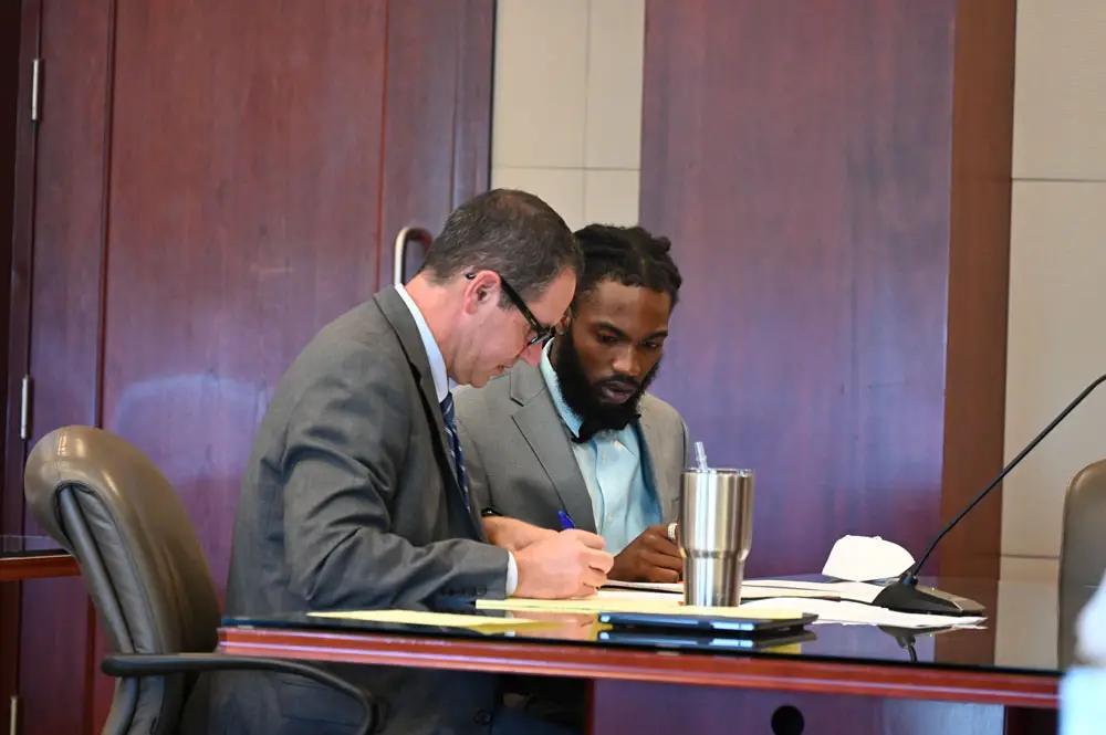 Deviaun Toler, right, with his attorney, John Hager, toward the end of today's daylong jury selection. Toler was not pleased with the results. (© FlaglerLive)