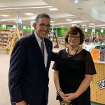 Flagler Palm Coast High School Principal Tom Russell with his wife Julie at the school in June 2019, shortly after his appointment. "It has shocked my family because of my vigilance about practicing safeguards," he wrote of his Covid-19 diagnosis. (© FlaglerLive)