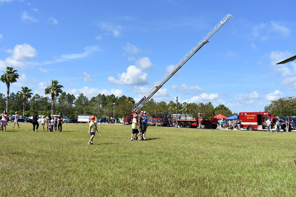 The Touch-a-Truck event Palm Coast organized in late May, where the city's fire chief, Jerry Forte, said he was approached by County Commissioner Joe Mullins, who spoke to him about Palm Coast taking over the county's fire services. (Palm Coast)