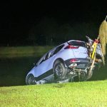 The 2021 Honda SUV getting pulled out of the pond at Grand Reserve in Bunnell last night. (© John's Towing)
