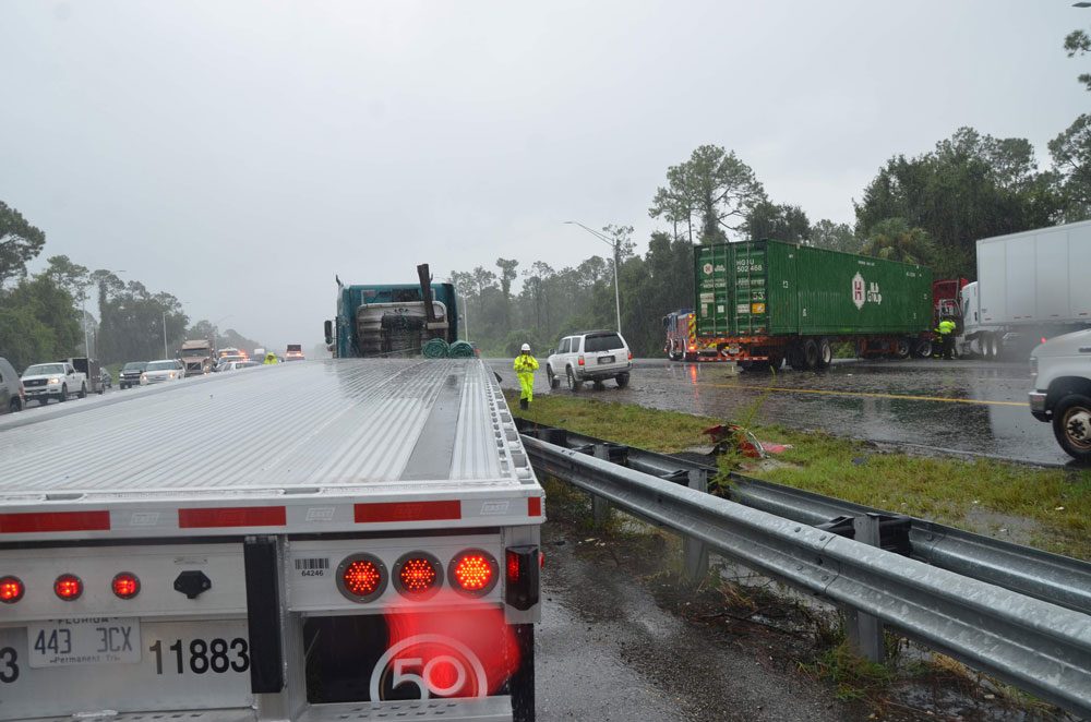 A third trailer had the left side of its cab smashed in, and ended up facing south, in the northbound emergency lane. (© FlaglerLive)