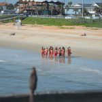 Lifeguards routinely train in Flagler Beach. The above is a file photo. (© FlaglerLive)