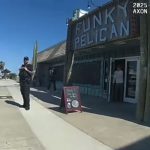 Jeff Gray, left, outside the Funky Pelican in Flagler Beach last March in a capture from Sgt. Austin Yelvington's bodycam video.
