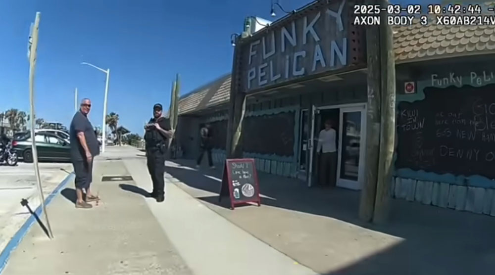 Jeff Gray, left, outside the Funky Pelican in Flagler Beach last March in a capture from Sgt. Austin Yelvington's bodycam video.