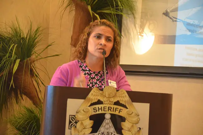 Trish Giaccone, executive director of the Family Life Center, Flagler's shelter for abused women and children, speaking at the kick-off of the domestic violence task force in June. (© FlaglerLive)