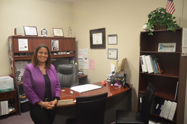 Family Life Center Executive Director Trish Giaccone in her new office. (© FlaglerLive)