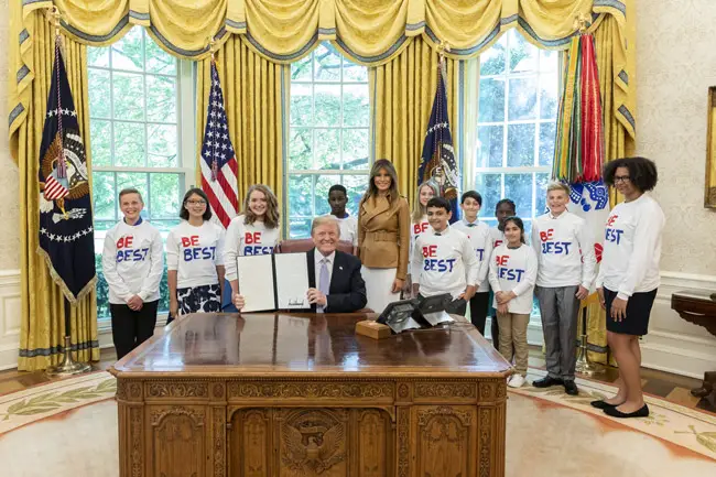 President Trump and Melania Trump signing a 'Be Best' initiative the day after Sen. Senator Jeff Merkley was barred from examining a children's detention center in Brownsville, Texas. (White House)