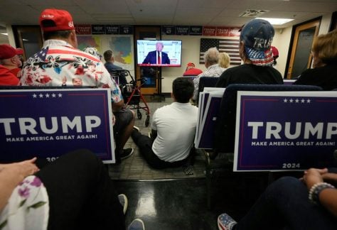 Phoenix residents watch presidential candidate Donald Trump speak at the Republican National Convention on July 18, 2024.