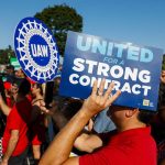 United Auto Workers members rally after marching in the Detroit Labor Day Parade on Sept. 4, 2023.