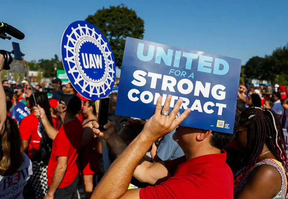 United Auto Workers members rally after marching in the Detroit Labor Day Parade on Sept. 4, 2023. 