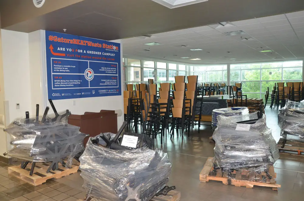 A common area at the University of Florida getting prepared for socially distanced dining. (© FlaglerLive)