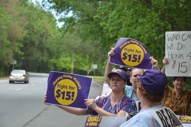 Underemployed workers at Grand Oaks, the nursing home and rehab center in Palm Coast, striking for higher wages last year. (© FlaglerLive)