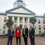 Palm Coast Mayor Milissa Holland today in Tallahassee, where she's been lobbying state lawmakers to land the University of North Florida's MedNex hub in Town Center, with, from left, City Manager Matt Morton, Allette Energy Chief Financial Officer and Douglas Properties President Jeff Douglas. (Palm Coast)