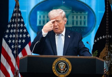 President Donald Trump mimics an Iranian protester being shot while holding a news conference in the White House on April 6, 2026. Tom