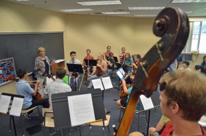 Artistic Director Sue Cryan prepares to lead a rehearsal of the upper orchestra today. Click on the image for larger view. (© FlaglerLive)