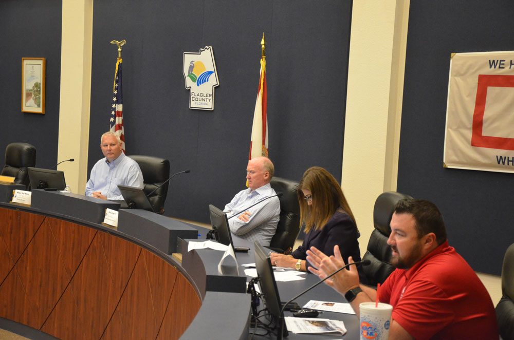 The U.S. Corps of Engineers briefed the public about its dunes-reconstruction project set to begin next spring in Flagler Beach, at a public hearing in Bunnell earlier this week. From left, Planning Manager William Weeks, consultant Chris Creed, County Engineer Faith al-Khatib, and Project Manager Jason Harrah. (© FlaglerLive)