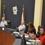 The U.S. Corps of Engineers briefed the public about its dunes-reconstruction project set to begin next spring in Flagler Beach, at a public hearing in Bunnell earlier this week. From left, Planning Manager William Weeks, consultant Chris Creed, County Engineer Faith al-Khatib, and Project Manager Jason Harrah. (© FlaglerLive)