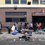 People wait in line for a free morning meal in Los Angeles in April 2020. High and rising inequality is one reason the U.S. ranks badly on some international measures of development. (Frederic J. Brown/ AFP via Getty Images)