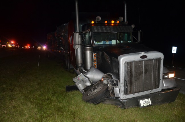 The 18-wheeler was severely damaged as it took evasive action to avoid hitting the F-150 head-on. The tractor trailer ended up in the median. Click on the image for larger view. (© FlaglerLive)