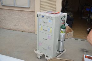 The portable emergency cart, in case of adverse reactions to the Covid-19 Moderna vaccine, sat unused today. click on the image for larger view. (© FlaglerLive)