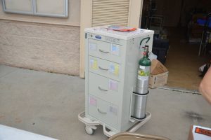 The portable emergency cart, in the event of adverse reactions to the Covid-19 Moderna vaccine, remained unused today.  Click on the image to enlarge.  (© FlaglerLive)