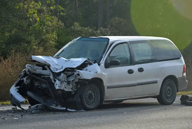 The Ford Windstar rear-ended a dump truck early this morning on U.S. 1 in Palm Coast. (© FlaglerLive)