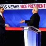 Two guys, shaking hands: Sen. JD Vance and Minnesota Gov. Tim Walz, ahead of their debate on Oct. 1, 2024