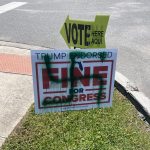 The vandalized sign at the Wickline Senior Center in Flagler Beach. The Supervisor of Elections sent the image to U.S. Rep. Randy Fine's office and removed the sign. (© FlaglerLive)