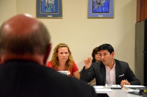 Will Vargas made his points, with Katie Hansen listening on. The man with his back to the camera is Jerry Copeland, the district's negotiator. Click on the image for larger view. (FlaglerLive)
