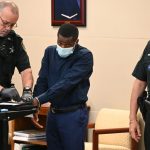 Dedorius Varnes getting fingerprinted after his sentencing this afternoon in Flagler County Circuit Court. (© FlaglerLive)