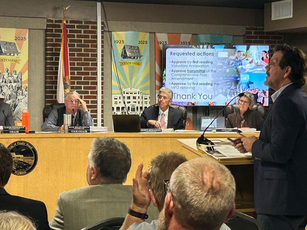 Veranda Bay/Summertown attorney Michael Chiumento, right, addressing members of the Flagler Beach City Commission Thursday evening. Commissioner Rick Belhumeur, left, motioned for approval of annexation of the Summertown segment. The vote carried, 4-1. (© Ben Belhumeur for FlaglerLive)