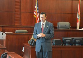 Assistant State Attorney Jason Lewis, during a break this morning, centered himself before delivering the prosecution's final closing argument. (© FlaglerLive)