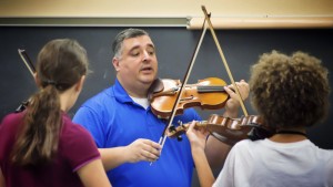 FYO instructor Victor Rivera with students Mareike Schwitzgebel, left, and Sabrine Sharp. Click on the image for larger view. (© Margie Casey for FlaglerLive)