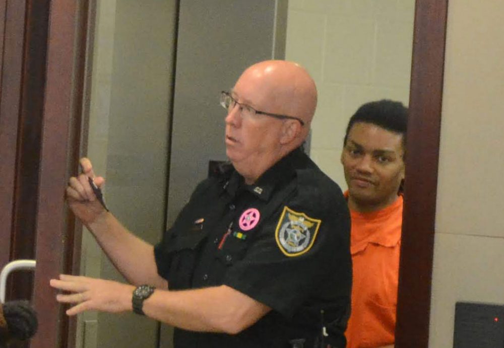 Victor Williams arriving in court today, behind sheriff's deputy Samuel Scott. (© FlaglerLive)