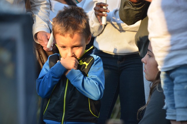 Elisa Marie Homen's son Vincent Vento Jr., who'll be 4 on February 1, was among the 50 people who turned up for a memorial Tuesday evening for Homen, at the site of the crash where she was fatally injured on Jan. 9. (© FlaglerLive)