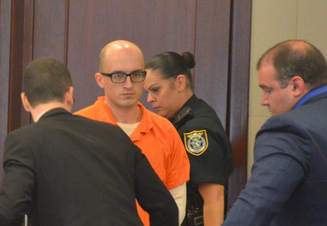 Vitaly Tsabak arriving in court this afternoon. His attorney, Aaron Delgado, is to the right. (© FlaglerLive)