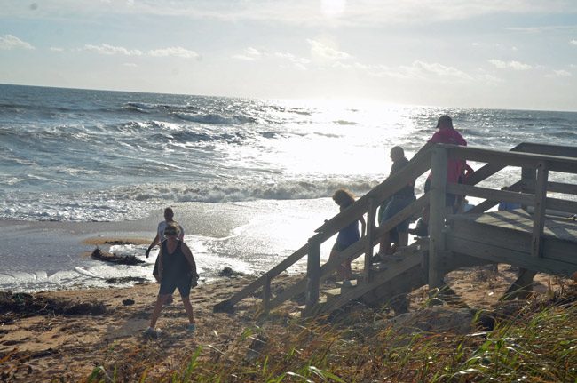 Some of the 150 volunteers who gathered on Sunday on Flagler Beach's sands to help clkean up the beaches and get them ready to reopen. That will happen Wednesday. (© FlaglerLive)