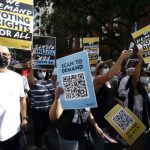 People march during a voting rights demonstration about voter suppression on Aug. 28, 2021, in Washington, D.C. (John Lamparski/Andalou Agency via Getty Images)
