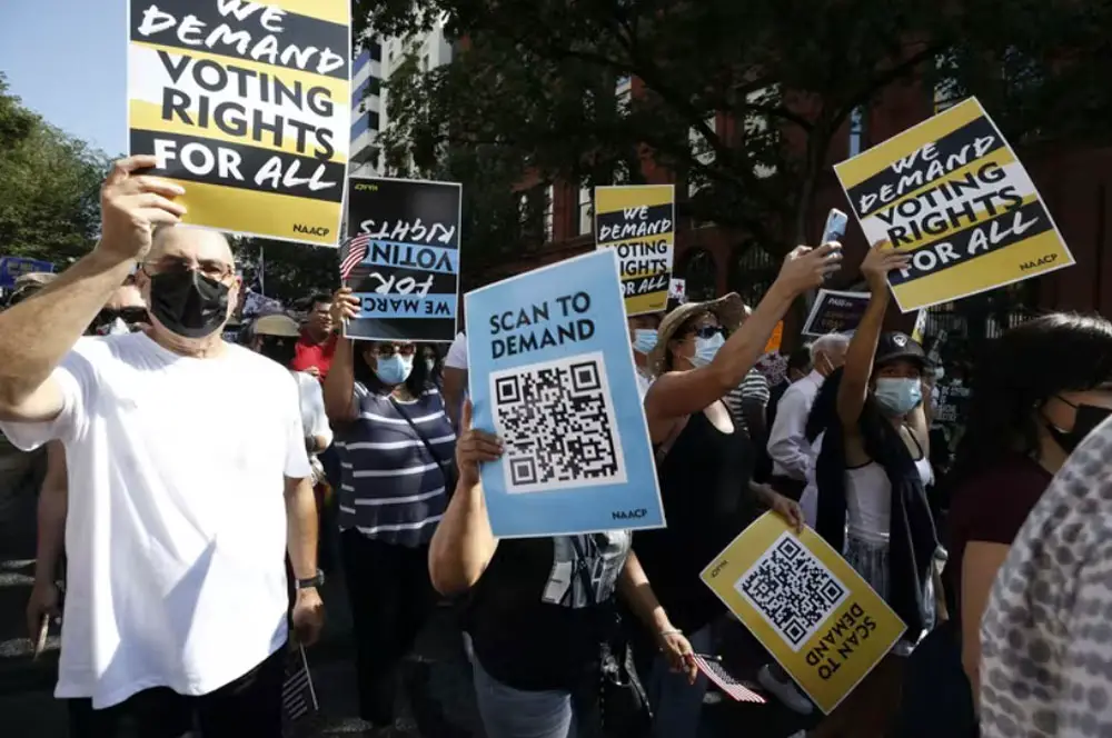 People march during a voting rights demonstration about voter suppression on Aug. 28, 2021, in Washington, D.C. (John Lamparski/Andalou Agency via Getty Images)