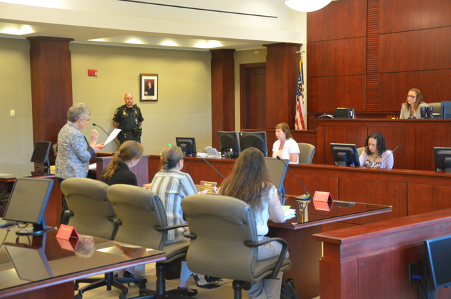 Clerk of Court Gail Wadsworth makes her case before County Judge Melissa Moore-Stens this morning. (© FlaglerLive)