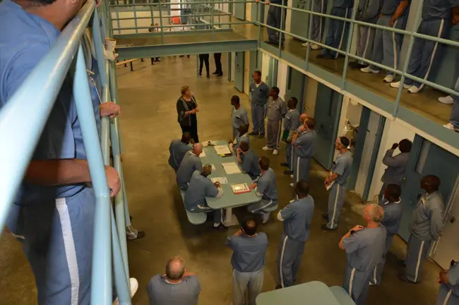 Expect fewer visiting hours. Florida prisons director Julie Jones, seen here speaking with inmates at Wakula prison, is proposing fewer visitation hours as a cost-cutting measure.