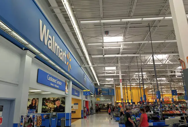 Walmart claims its own way of conserving energy should spare it the charge it must pay on its monthly bills for a conservation program. (© FlaglerLive)