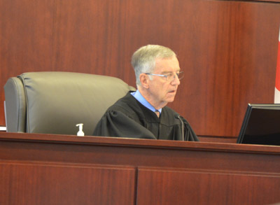 Senior Judge J. David Walsh sat in for Dennis Craig at today's hearing. (© FlaglerLive)