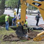 A Flagler Beach public works crew was busy repairing the latest water main break this morning just outside the Flagler shopping center. (© FlaglerLive)