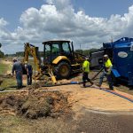Flagler Beach crews working on repairing the water main break on State Road 100 this afternoon. (© FlaglerLive)