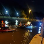 A Flagler County Fire Rescue paramedic tows the two men, stranded in a john boat for over six hours, back to shore at Bing's Landing Friday night. (FCSO)