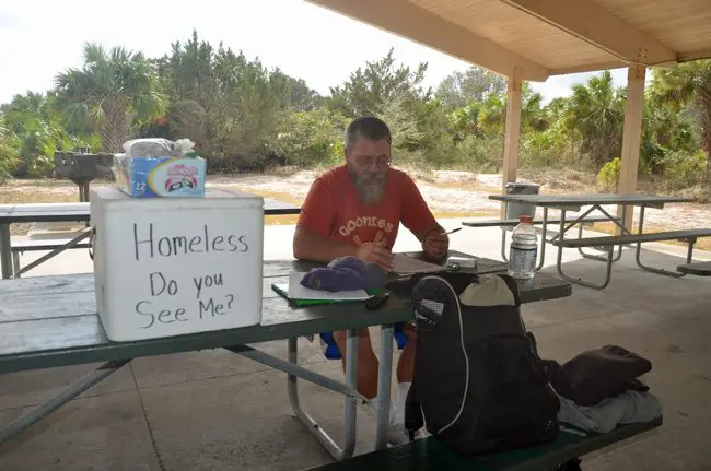 Wayne Perry, who had been the face of homelessness in Flagler, last December at a park in Flagler Beach. A county agency helped secure money through the Sheltering Tree, the volunteer organization, to pay for a bus ticket so he could travel back to Washington State. (c FlaglerLive)